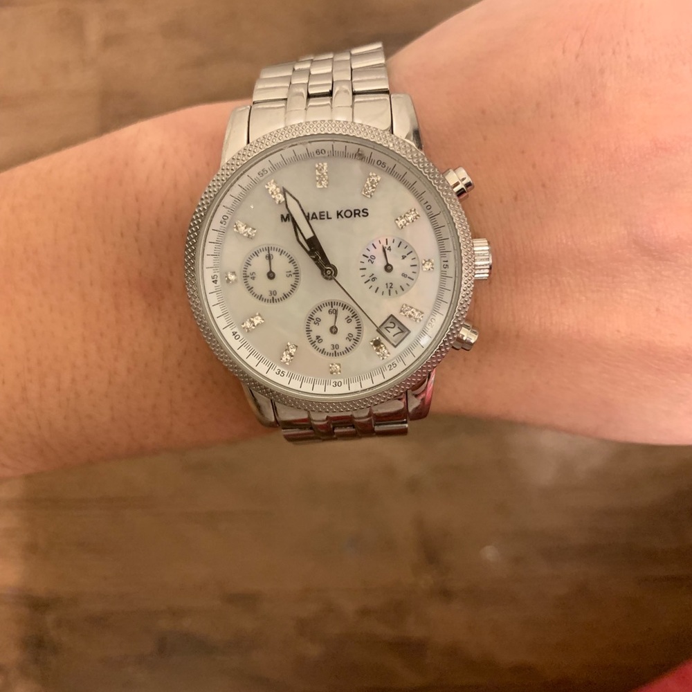 Women’s silver Michael Kors watch